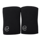 Two black knee pads with a logo on a light gray background